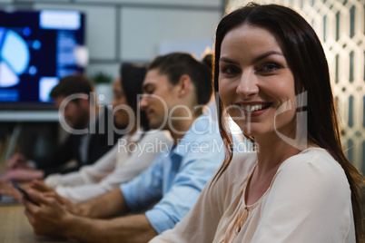 Female executive relaxing in conference room