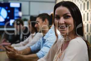 Female executive relaxing in conference room