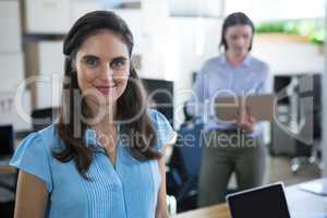 Female executive looking into camera in the office