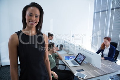 Beautiful female executive looking at camera