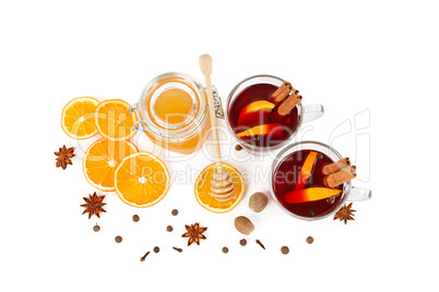 Hot red mulled wine, bee honey, slices of oranges and spices iso