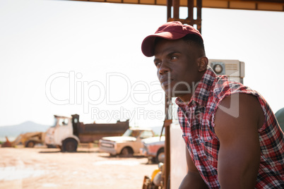 Man relaxing at petrol pump station