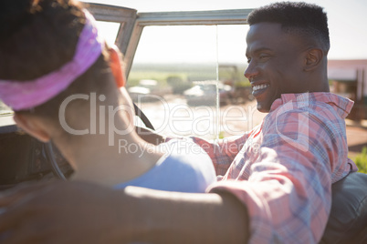 Couple interacting with each other in car