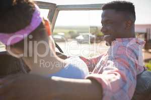 Couple interacting with each other in car