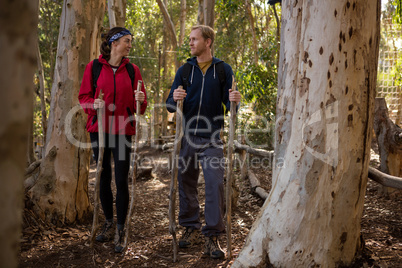 Hiker couple standing in forest