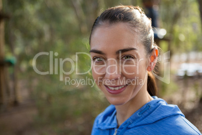 Happy young woman in forest