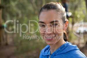 Happy young woman in forest