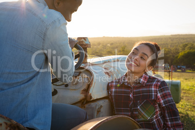 Happy couple looking at each other in countryside