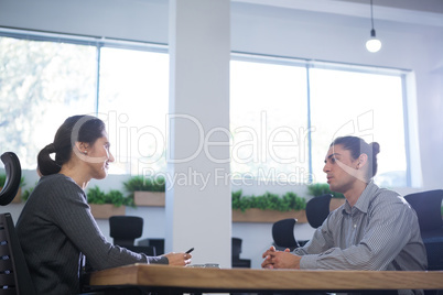 Female executive taking interview of man