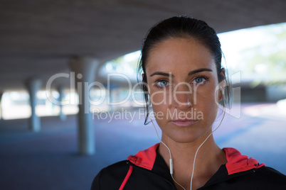 Fit woman standing in underground parking area