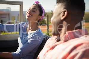 Couple interacting with each other in car