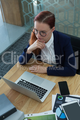 High angle view of female executive working at desk
