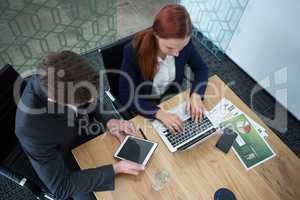 High angle view of business executives working at desk