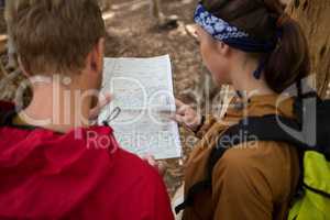 Hiker couple checking the map