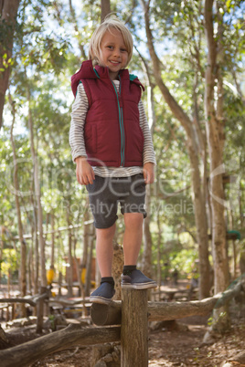 Little girl walking on woods in the forest