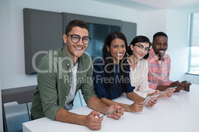 Business executives using glass digital tablet