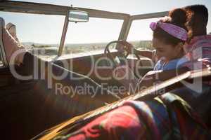 Couple sitting together in car