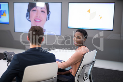 Executives having video call in boardroom