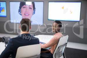 Executives having video call in boardroom