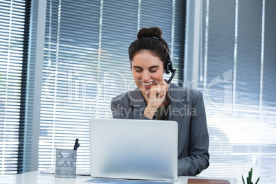 Female executive doing video call on laptop