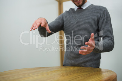 Executive gesturing at table in office