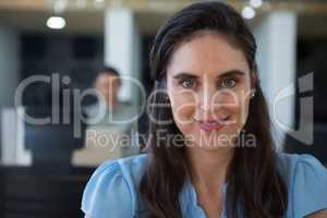 Beautiful female executive looking at camera