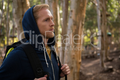 Athletic man looking at forest