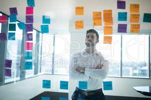 Male executive reading sticky note