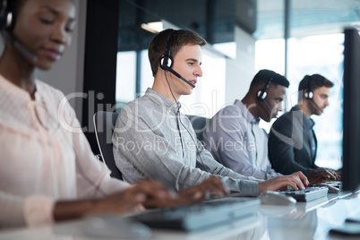 Customer service executives working at office