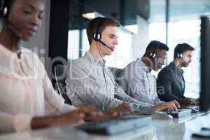 Customer service executives working at office