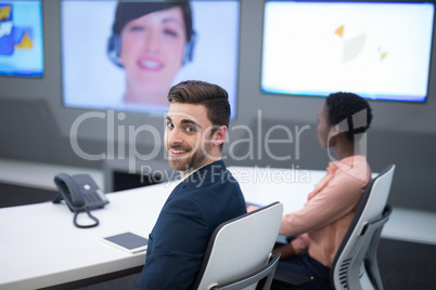 Executive having video call in boardroom
