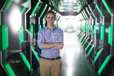 Male executive standing in futuristic office