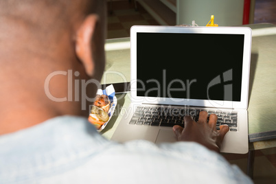 Man using laptop in the restaurant