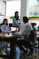 Executives shaking hands in the office