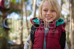 Portrait of beautiful little girl with backpack