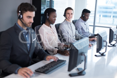 Customer service executives working at office