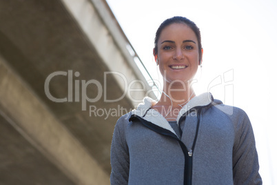 Female jogger smiling at camera