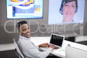 Male executive using laptop while having video call