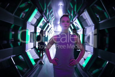 Female executive standing in futuristic office