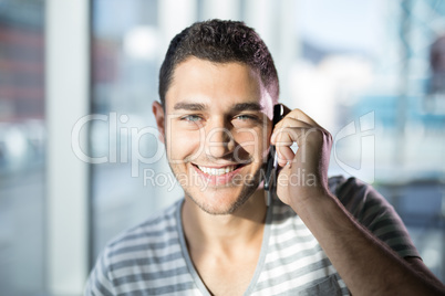 Portrait of male executive talking on mobile phone