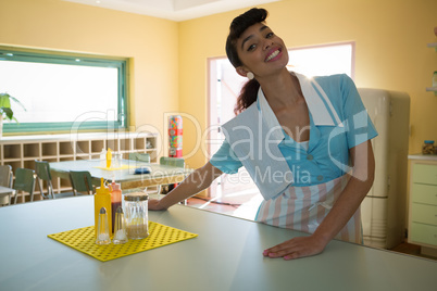 Waitress standing at counter