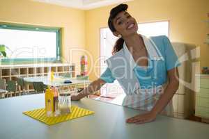 Waitress standing at counter