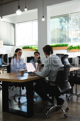 Executive working on laptop at desk