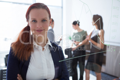 Beautiful female executive looking at camera