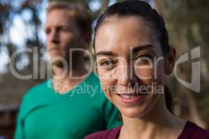 Woman smiling trainer in background