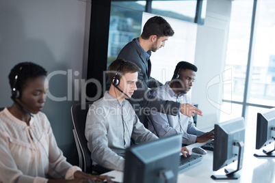 Customer service executive trainer monitoring her team