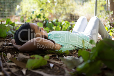 Little girl lying on floor relaxing on a sunny day