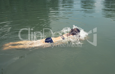 girl swimming in a lake