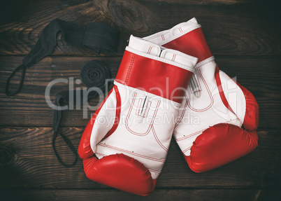 a pair of leather red boxing gloves