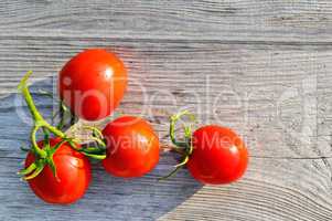 Red tomatoes on wooden surface. Flat lay,top view.